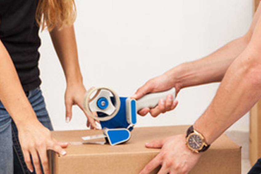 Movers unloading a moving van